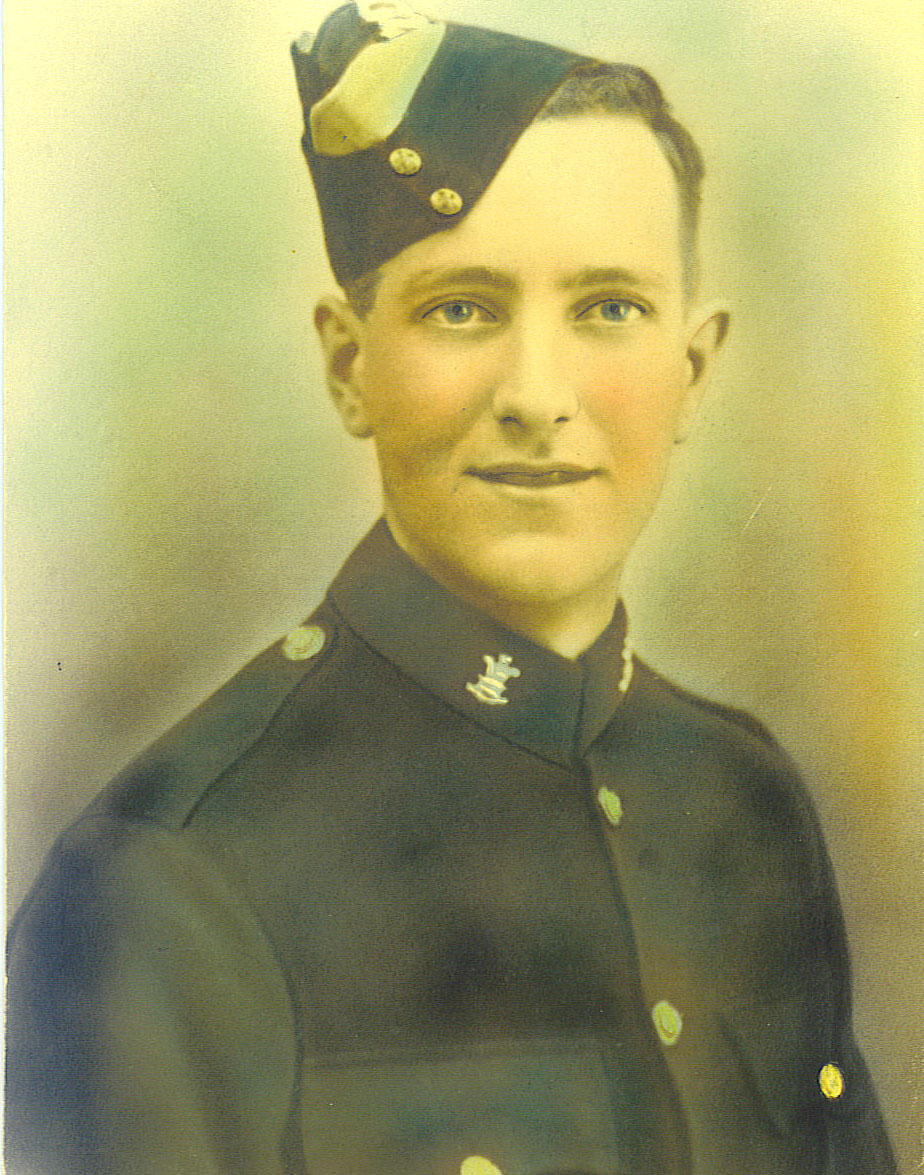 A hand-tinted studio portrait of Bill Troughton in uniform as a young man.