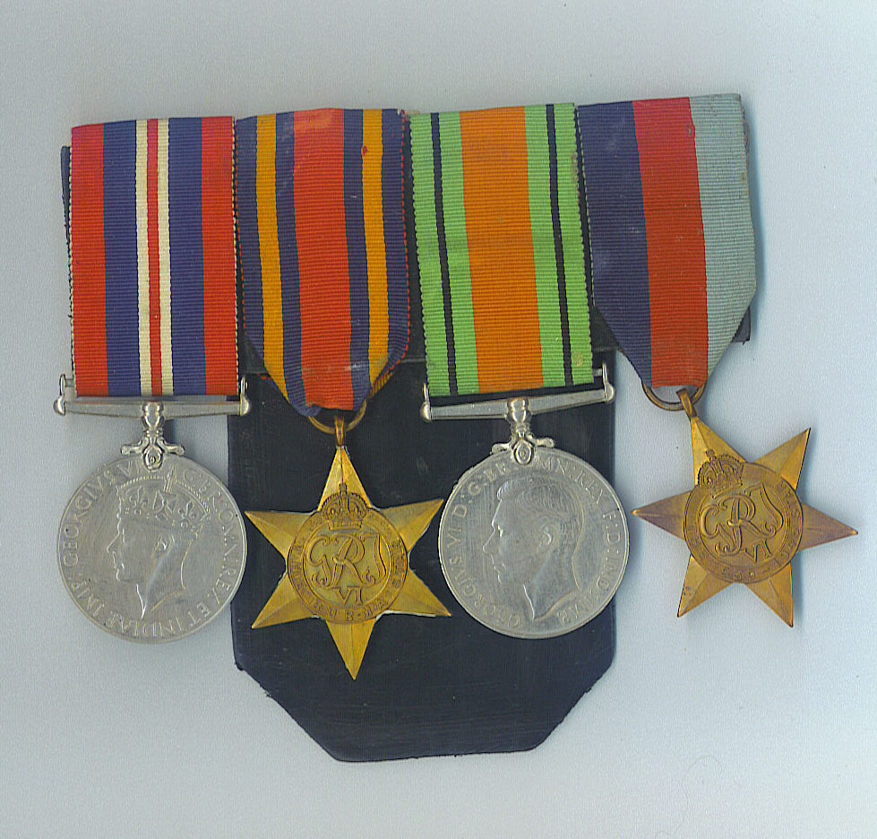 Four Second World War medals and stars mounted on a bar, with their striped ribbons.